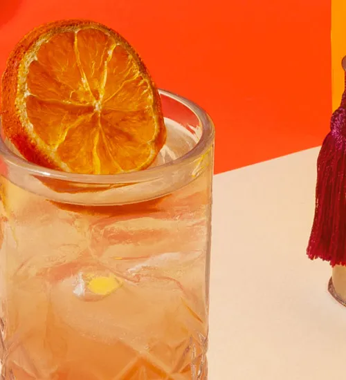 Cointreau Singapore Sling cocktail with Cointreau bottle