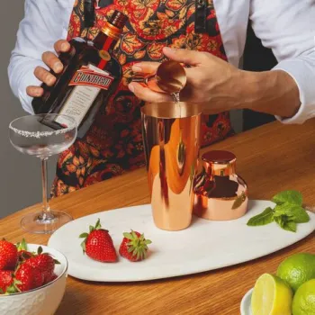 <p>Combine Cointreau, Tequila, lime and strawberries in a shaker with ice.</p>