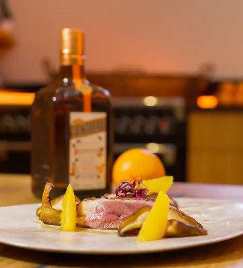 Duck breast flambéed with Cointreau, orange sauce Cointreau International