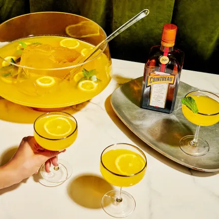 Coupe of Gold Batch Cocktail with Cointreau