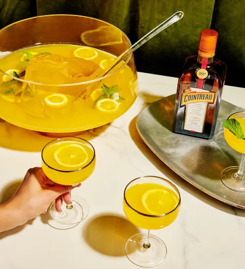Coupe of Gold Batch Cocktail with Cointreau