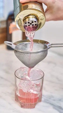 Raspberry Thyme Margarita Pouring